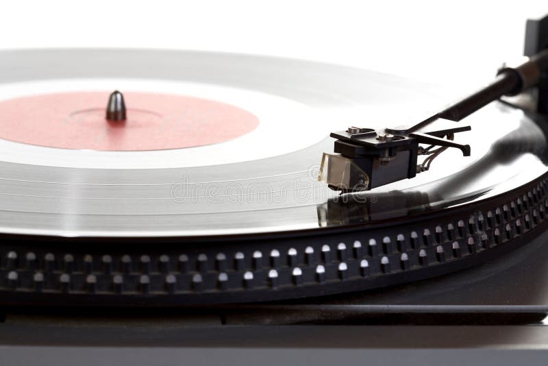 Old player and vinyl phonograph record on a white background. Old player and vinyl phonograph record on a white background