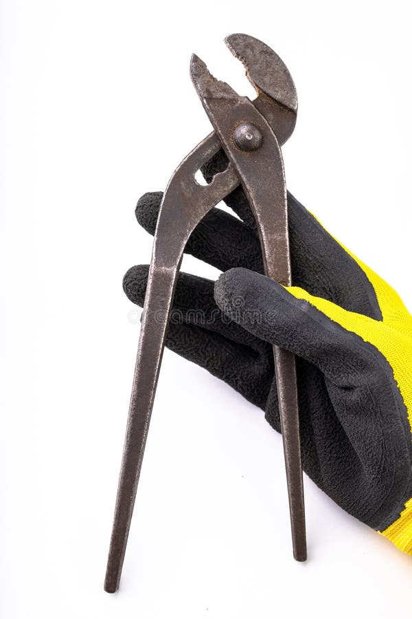 Старый гидравлический ключ в вашей руке Аксессуары для механика и workwear стоковая фотография rf Старый гидравлический ключ в вашей руке Аксессуары для механика и workwear стоковая фотография rf