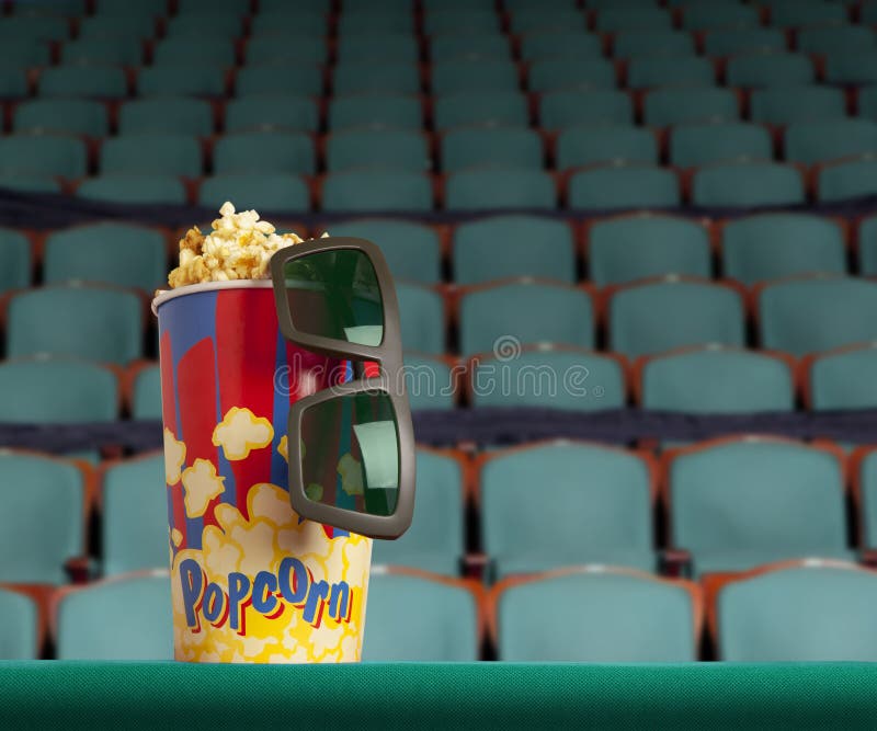 стекла 3d и попкорн на зеленом кино кресла стоковое фото rf стекла 3d и попкорн на зеленом кино кресла стоковое фото rf