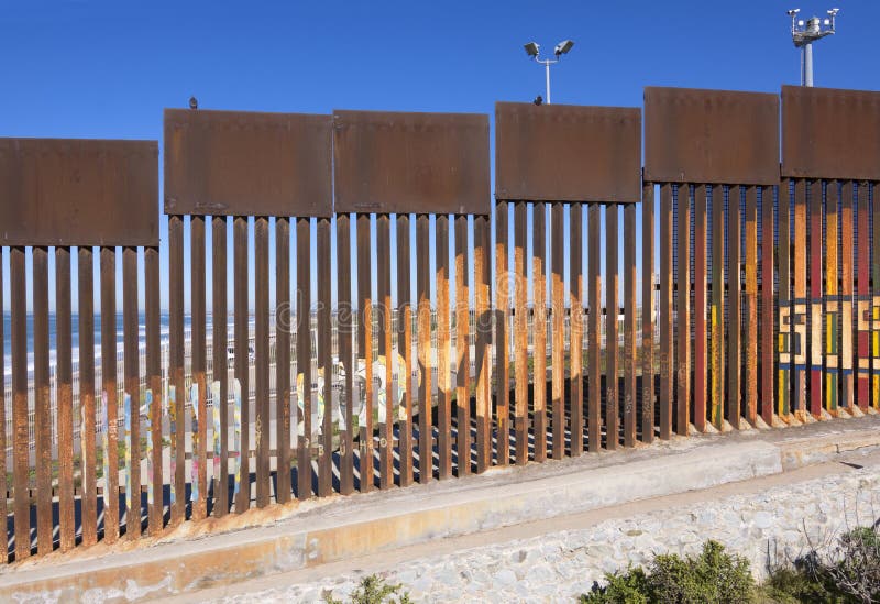 Steel fence made of vertical girders separating Mexico from the United States in a secured political boundary in Playas de Tijuana in Mexico. Steel fence made of vertical girders separating Mexico from the United States in a secured political boundary in Playas de Tijuana in Mexico