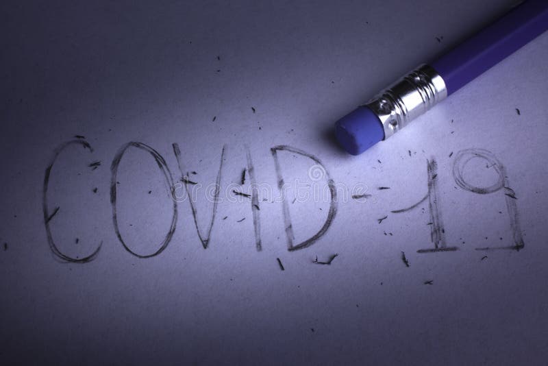 Erase the word covid-19 with an eraser - removing coronavirus. Erase the word covid-19 with an eraser - removing coronavirus