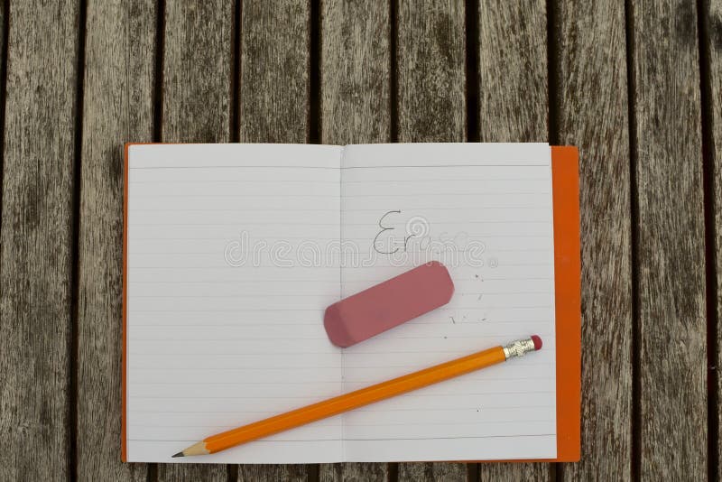 Erase with Eraser and Pencil on notebook. Erase with Eraser and Pencil on notebook