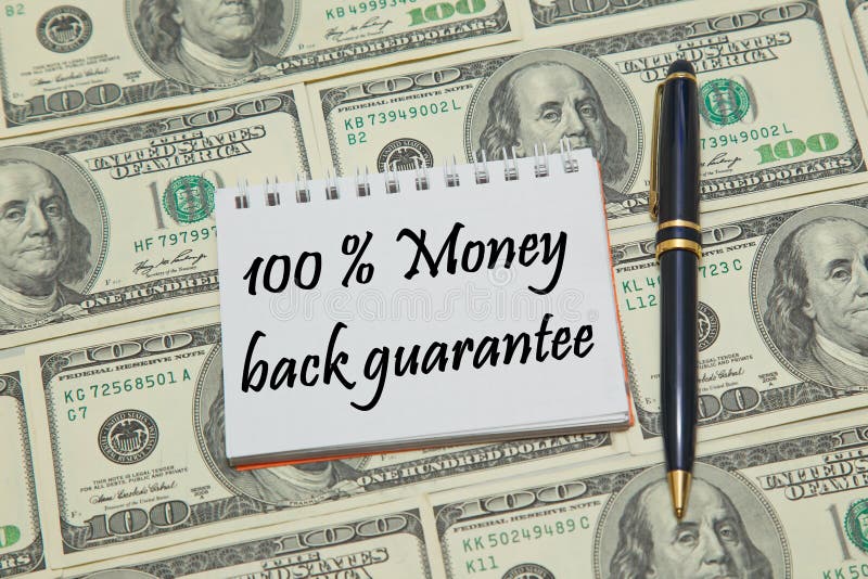 Notebook page with text 100% MONEY BACK GUARANTEE on dollar background Closeup. Notebook page with text 100% MONEY BACK GUARANTEE on dollar background Closeup