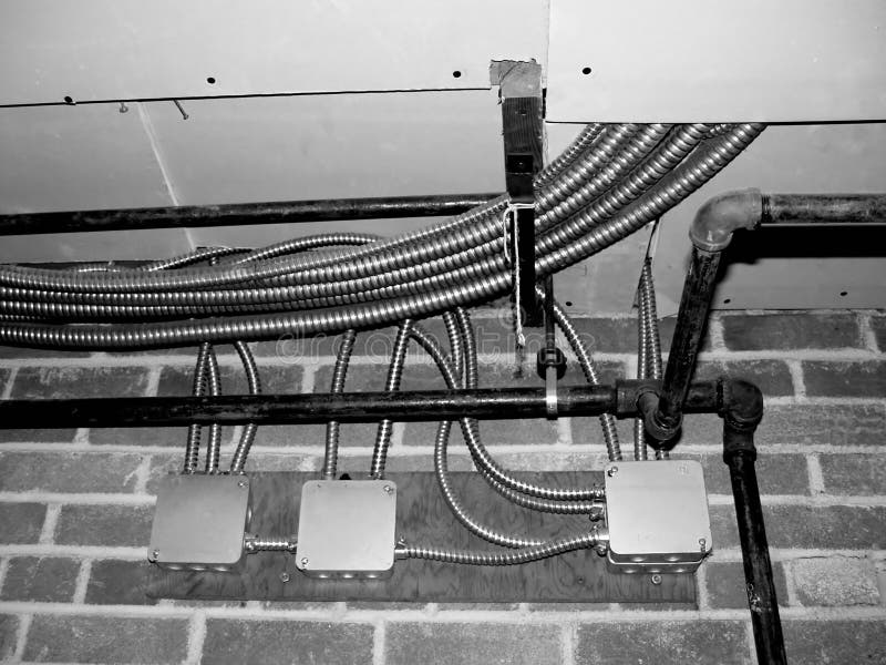 Electrical Wire in a appartment Building with pipes and bricks. Electrical Wire in a appartment Building with pipes and bricks