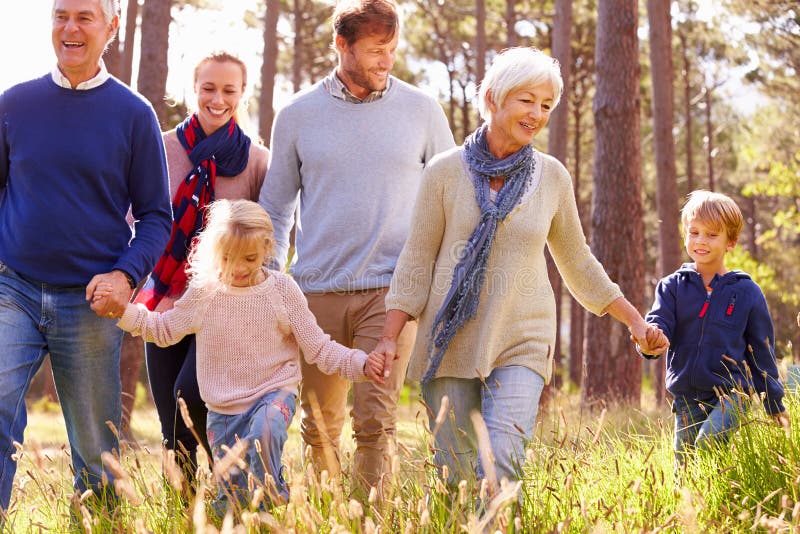 Happy multi-generation family walking in the countryside. Happy multi-generation family walking in the countryside