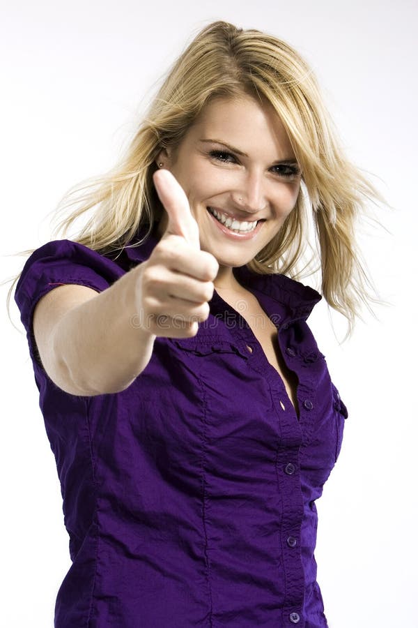 Happy enthusiastic blond woman giving a thumbs up sign of agreement amd approval, upper body studio portrait on white. Happy enthusiastic blond woman giving a thumbs up sign of agreement amd approval, upper body studio portrait on white