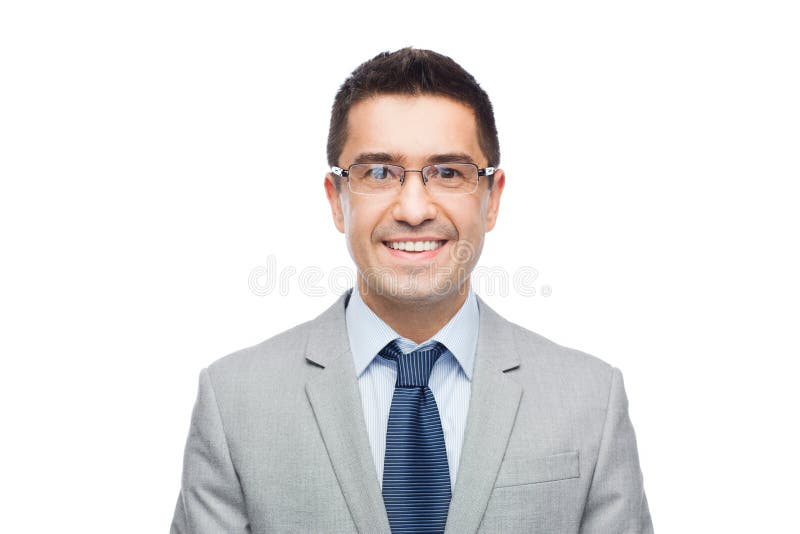 Счастливый усмехаясь бизнесмен в eyeglasses и костюме стоковое фото