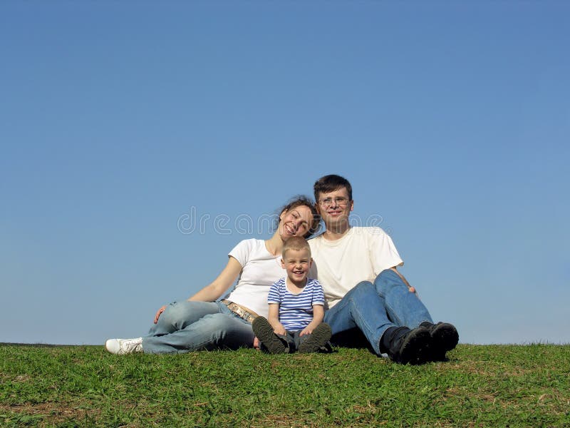 Family with son. meadow. clear sky. Family with son. meadow. clear sky