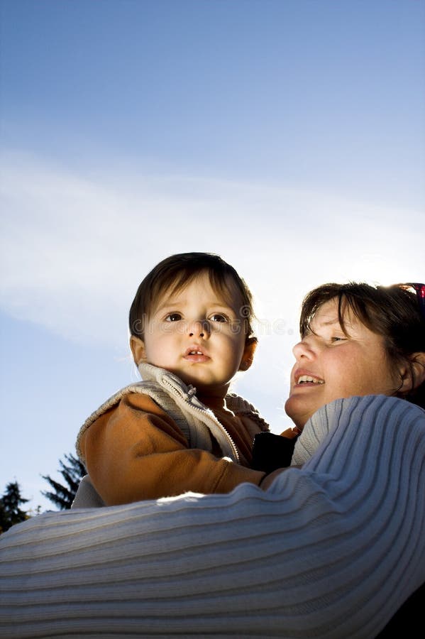 Mother and son over blue sky. Mother and son over blue sky