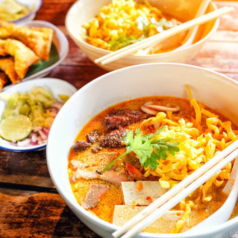 Northern Thai  Curried noodle soup Khao soi with chicken meat and spicy coconut milk. Northern Thai  Curried noodle soup Khao soi with chicken meat and spicy coconut milk