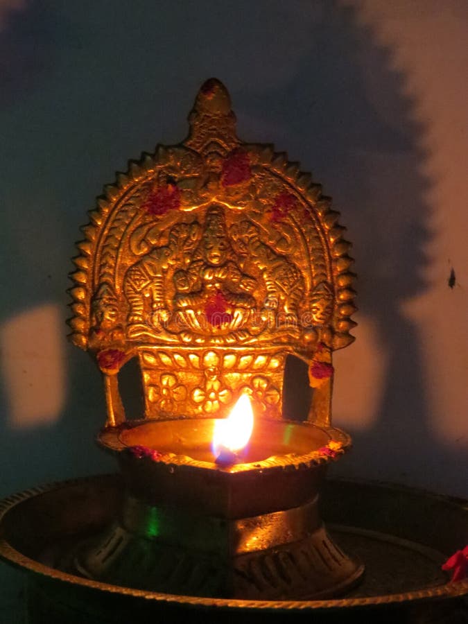 Tamil Nadu Traditional Copper Candle lightened in pooja room. Tamil Nadu Traditional Copper Candle lightened in pooja room