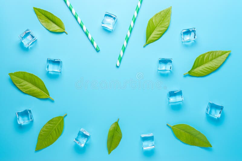Creative summer composition with straw and ice cubes on blue background. Minimal drink concept. Creative summer composition with straw and ice cubes on blue background. Minimal drink concept.