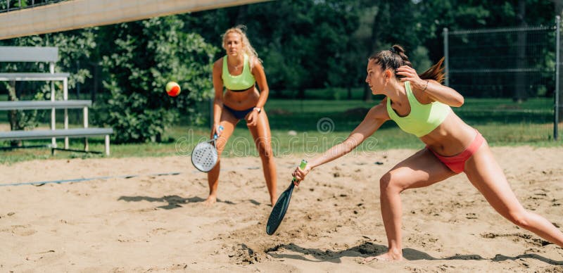 Beach Tennis Player Hits the Ball. Beach Tennis Player Hits the Ball