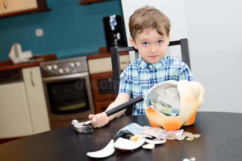 4 year old boy and smashed his piggybank at home. 4 year old boy and smashed his piggybank at home