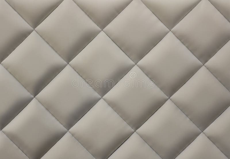 Close-up of beige quilted fabric background. Close-up of beige quilted fabric background