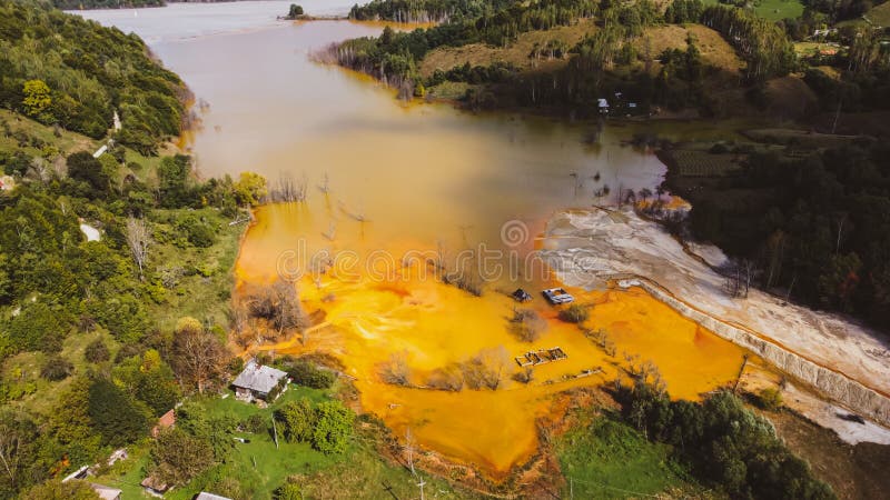 Aerial View Over Lake Polluted With Toxic Mining Residuals Tailings From an Open Pit Copper Mine in Geamana, Rosia Poieni, Romania. Aerial View Over Lake Polluted With Toxic Mining Residuals Tailings From an Open Pit Copper Mine in Geamana, Rosia Poieni, Romania