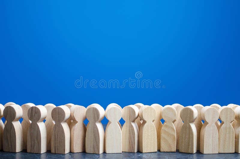 A crowd of wooden figures of people. Customers and buyers, statistics, preferences of Population. group of citizens, rally, political movement or electorate. Society, demography. Employees. Copy space. A crowd of wooden figures of people. Customers and buyers, statistics, preferences of Population. group of citizens, rally, political movement or electorate. Society, demography. Employees. Copy space