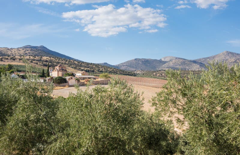 Walled courtyard around church in boutique hotel Cortijo del Marques with hills in distance near Granada, Andalucia, Spain. Walled courtyard around church in boutique hotel Cortijo del Marques with hills in distance near Granada, Andalucia, Spain