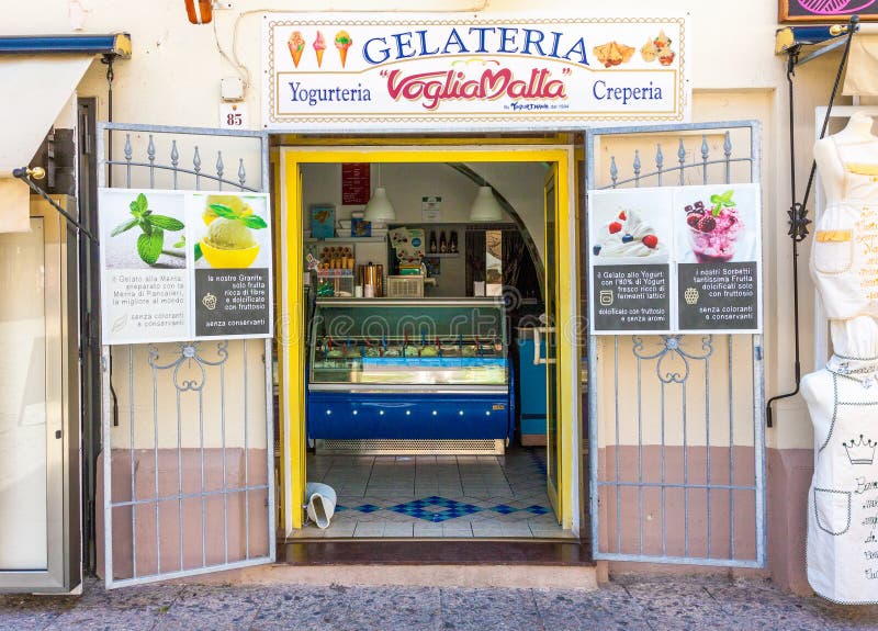 Alghero, Italy - July 2, 2016: Street view of gelateria exterior, traditional Italian ice cream shop in Alghero, Sardinia, Italy. Alghero, Italy - July 2, 2016: Street view of gelateria exterior, traditional Italian ice cream shop in Alghero, Sardinia, Italy.