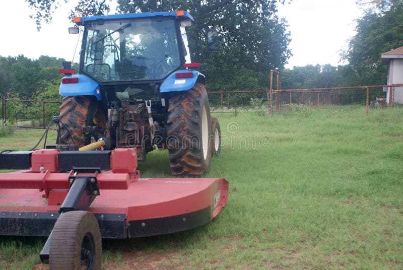 SONY DSC Here is a tractor with a shredder just in from mowing the pastures that are not being used to grow hay to feed the cows. Looking in the back window of my office. SONY DSC Here is a tractor with a shredder just in from mowing the pastures that are not being used to grow hay to feed the cows. Looking in the back window of my office.