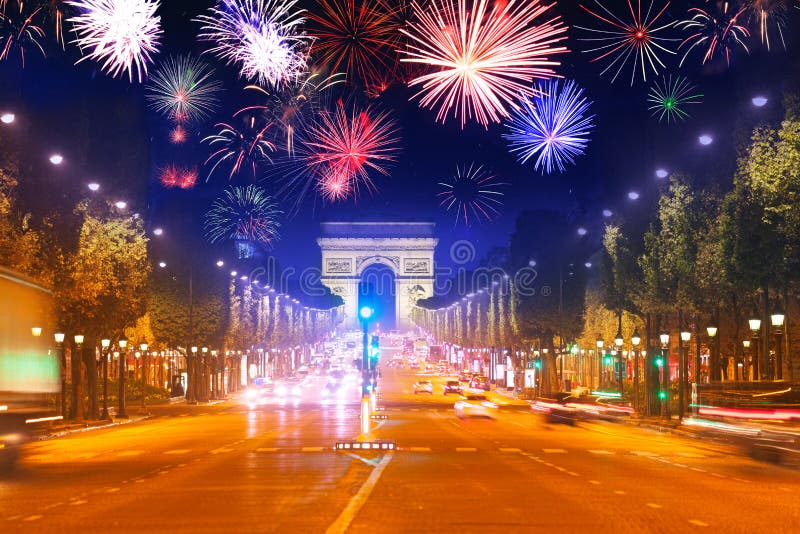 Arc de triumph in Paris, Champs Elysee boulevard and fireworks in the night sky, France. Arc de triumph in Paris, Champs Elysee boulevard and fireworks in the night sky, France