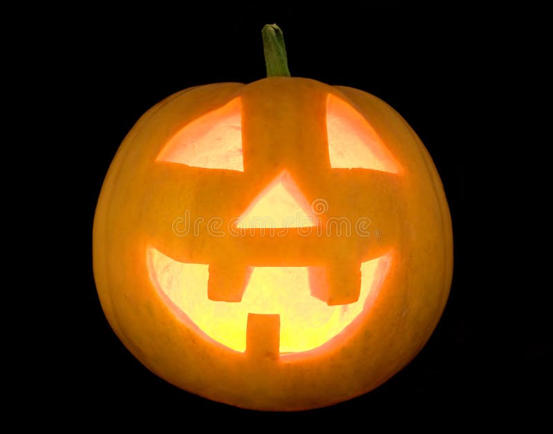 Halloween pumpkin lightened face isolated on black. Halloween pumpkin lightened face isolated on black