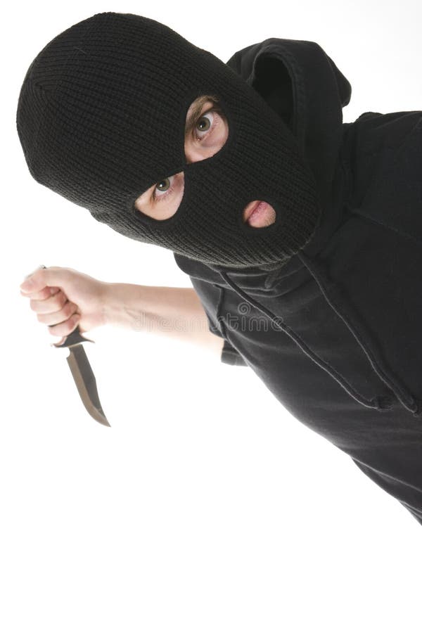 Evil criminal wearing balaclava with a knife. Evil criminal wearing balaclava with a knife