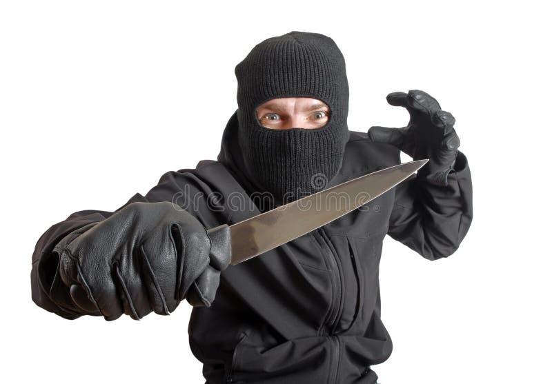 Masked criminal holding a knife, isolated on white. Masked criminal holding a knife, isolated on white