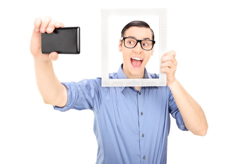 Man taking a selfie and holding a picture frame isolated on white background. Man taking a selfie and holding a picture frame isolated on white background