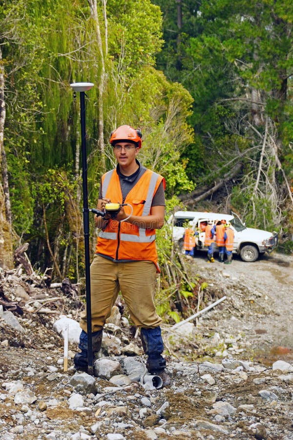 Man surveying the location of geophones for a seismic reflective survey on the West Coast of New Zealand. Man surveying the location of geophones for a seismic reflective survey on the West Coast of New Zealand