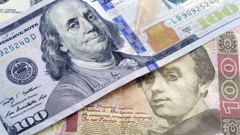 Украинское hryvnia наличных денег и доллары США Concep курса валюты стоковое фото Украинское hryvnia наличных денег и доллары США Concep курса валюты стоковое фото