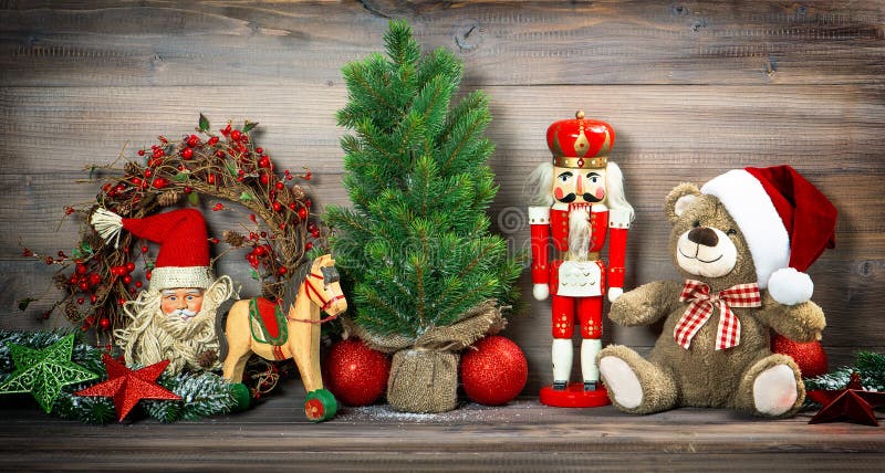 Nostalgic christmas decoration with antique toys teddy bear and nutcracker. retro style toned picture. Nostalgic christmas decoration with antique toys teddy bear and nutcracker. retro style toned picture