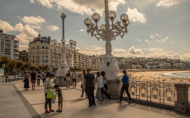 SAN SEBASTIAN, SPAIN - SEPTEMBER 2018. Streets next to the beach of La Concha in San Sebastian with people walking in them. ItÂ´s a editorial picture. SAN SEBASTIAN, SPAIN - SEPTEMBER 2018. Streets next to the beach of La Concha in San Sebastian with people walking in them. ItÂ´s a editorial picture.