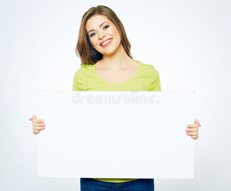 Smiling woman holding white sign board. portrait of smiling young model with long hair. isolated girl portrait. Smiling woman holding white sign board. portrait of smiling young model with long hair. isolated girl portrait.