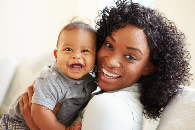 Smiling Mother Playing With Baby Son At Home. Smiling Mother Playing With Baby Son At Home