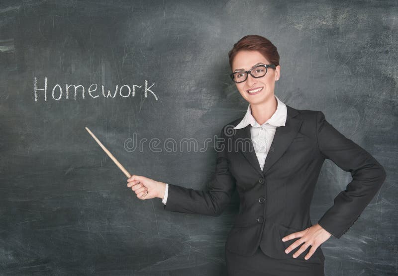 Smiling teacher with pointer and phrase Homework on blackboard chalkboard. Smiling teacher with pointer and phrase Homework on blackboard chalkboard