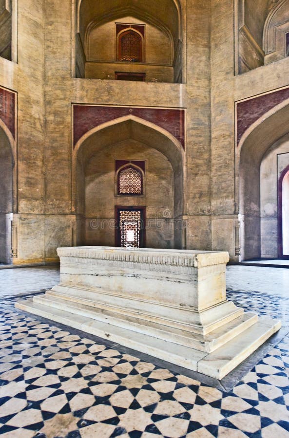 DELHI, INDIA - NOVEMBER 11, 2011: marble tomb inside Humayuns tomb in Delhi, India. The tomb was commissioned by Humayun's first wife Bega Begum in 1569. DELHI, INDIA - NOVEMBER 11, 2011: marble tomb inside Humayuns tomb in Delhi, India. The tomb was commissioned by Humayun's first wife Bega Begum in 1569.