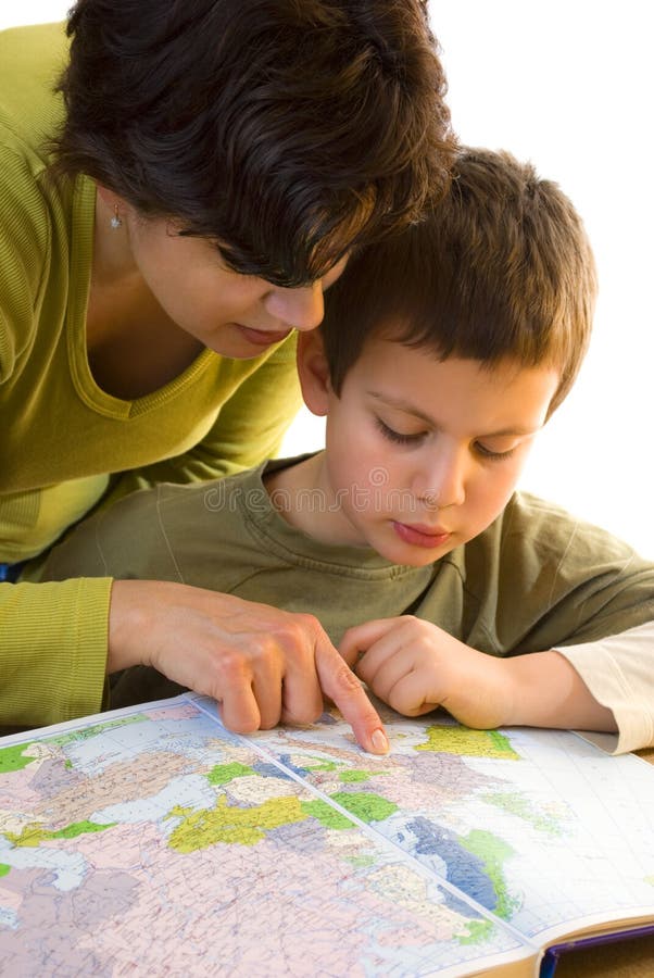 Closeup of young geography teacher with boy looking at map, isolated on white background. Closeup of young geography teacher with boy looking at map, isolated on white background.