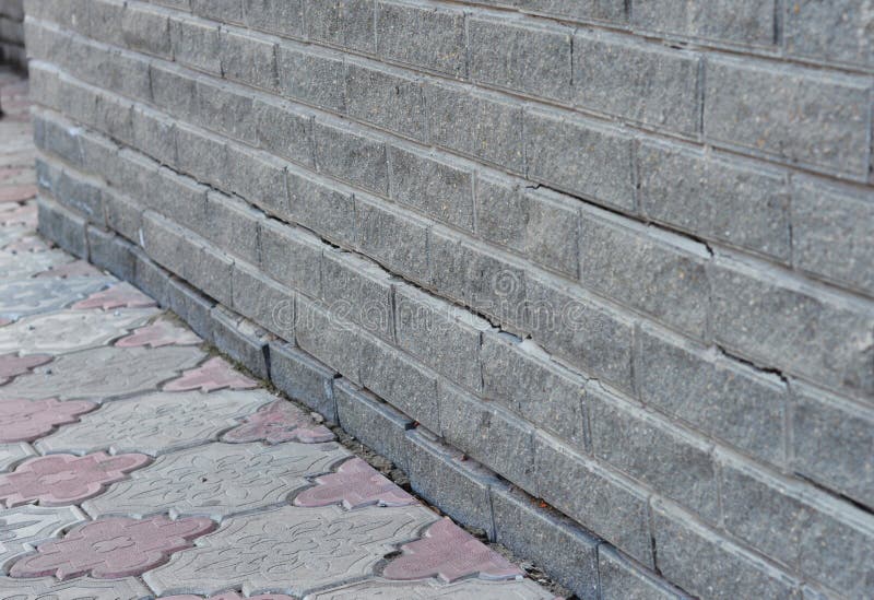 Foundation Cracks Repair - Warning Signs. House foundation repair. Cracked Foundation Repair. Broken Foundation House Brick Wall. Foundation Cracks Repair - Warning Signs. House foundation repair. Cracked Foundation Repair. Broken Foundation House Brick Wall.