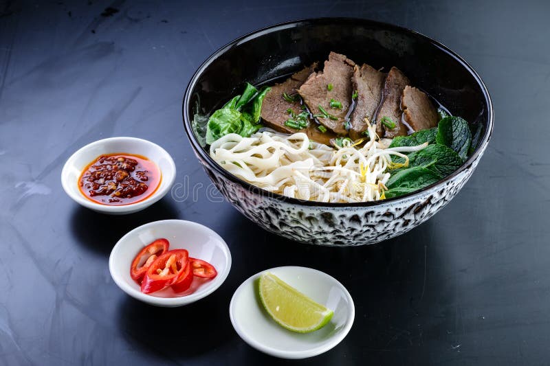 pho bo soup with beef, Vietnamese food, rice noodle soup with sliced beef. Vietnam&#x27;s national dish. pho bo soup with beef, Vietnamese food, rice noodle soup with sliced beef. Vietnam&#x27;s national dish