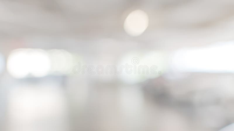 Parking garage blur abstract background with blurry building interior lot space and bright illumination light bokeh for automotive vehicle and car insurance safety concept. Parking garage blur abstract background with blurry building interior lot space and bright illumination light bokeh for automotive vehicle and car insurance safety concept