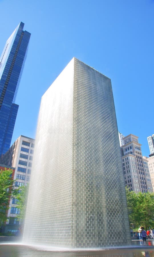 Crown Fountain is an interactive work of public art and video sculpture featured in Millennium Park (Chicago, Illinois), which is located in the Loop community area. Designed by Catalan artist Jaume Plensa and executed by Krueck and Sexton Architects, it opened in July 2004. The fountain is composed of a black granite reflecting pool placed between a pair of glass brick towers. The towers are 50 feet (15.2 m) tall, and they use light-emitting diodes (LEDs) to display digital videos on their inward faces. Crown Fountain is an interactive work of public art and video sculpture featured in Millennium Park (Chicago, Illinois), which is located in the Loop community area. Designed by Catalan artist Jaume Plensa and executed by Krueck and Sexton Architects, it opened in July 2004. The fountain is composed of a black granite reflecting pool placed between a pair of glass brick towers. The towers are 50 feet (15.2 m) tall, and they use light-emitting diodes (LEDs) to display digital videos on their inward faces.