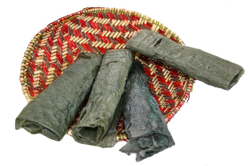 Piki Bread, a traditional Hopi Indian food made from Blue Maize, served on a hand-made red and cream basket. Piki Bread, a traditional Hopi Indian food made from Blue Maize, served on a hand-made red and cream basket.