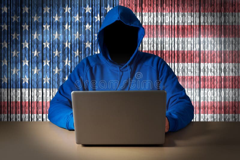 Hacker sitting in front of a laptop on background of digital flag of United States of America. Cyber Security concept. Hacker sitting in front of a laptop on background of digital flag of United States of America. Cyber Security concept.