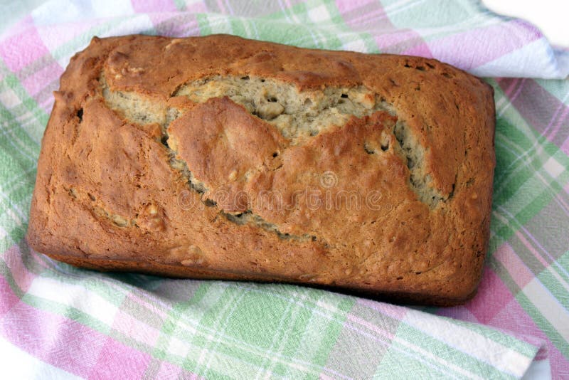 Homemade banana bread wrapped in a cloth napkin. Homemade banana bread wrapped in a cloth napkin.