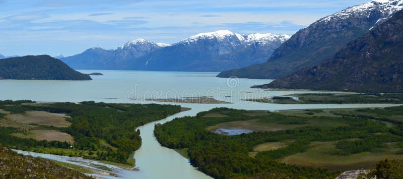 The Baker River is a river located in the Aysen Region of the Chilean Patagonia. It is Chile`s largest river in terms of volume of water. The river flows out of Bertrand Lake, which is fed by General Carrera Lake. It runs along the east side of the Northern Patagonian Ice Field and empties into the Pacific Ocean, near the town of Caleta Tortel. The river forms a delta, dividing into two major arms, of which only the northernmost one is navigable. Its characteristic turquoise-blue color is due to the glacial sediments deposited in it. It was the proposed site of a controversial major hydro-electric project, involving five dams, to be the biggest in the history of Chile. Called HidroAysÃ©n, the project was a joint venture between Endesa Chile a subsidiary of the international energy conglomerate Enel, and ColbÃºn S.A. a subsidiary of Minera ValparaÃ­so. The Baker River is a river located in the Aysen Region of the Chilean Patagonia. It is Chile`s largest river in terms of volume of water. The river flows out of Bertrand Lake, which is fed by General Carrera Lake. It runs along the east side of the Northern Patagonian Ice Field and empties into the Pacific Ocean, near the town of Caleta Tortel. The river forms a delta, dividing into two major arms, of which only the northernmost one is navigable. Its characteristic turquoise-blue color is due to the glacial sediments deposited in it. It was the proposed site of a controversial major hydro-electric project, involving five dams, to be the biggest in the history of Chile. Called HidroAysÃ©n, the project was a joint venture between Endesa Chile a subsidiary of the international energy conglomerate Enel, and ColbÃºn S.A. a subsidiary of Minera ValparaÃ­so.