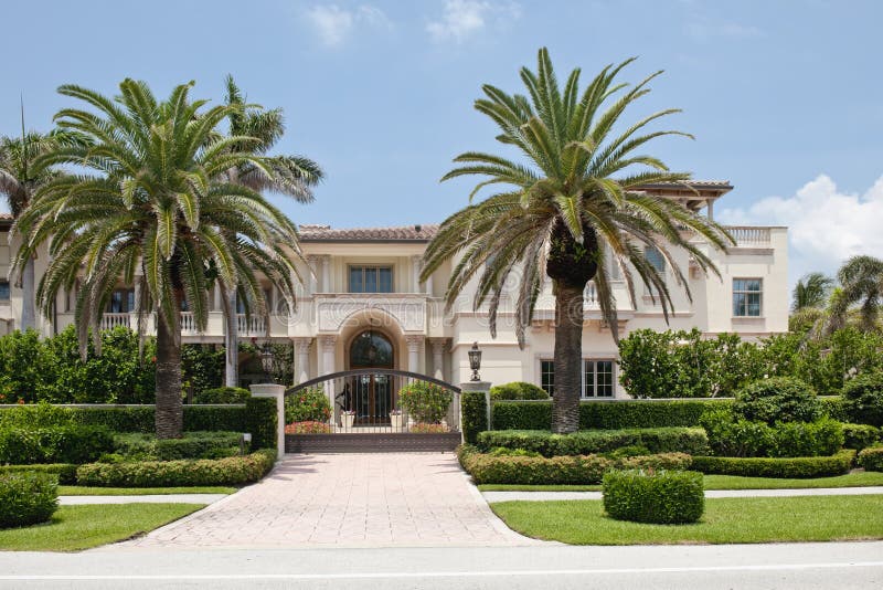 Details of luxurious, detached Florida mansion with palm trees in foreground, U.S.A. Details of luxurious, detached Florida mansion with palm trees in foreground, U.S.A.
