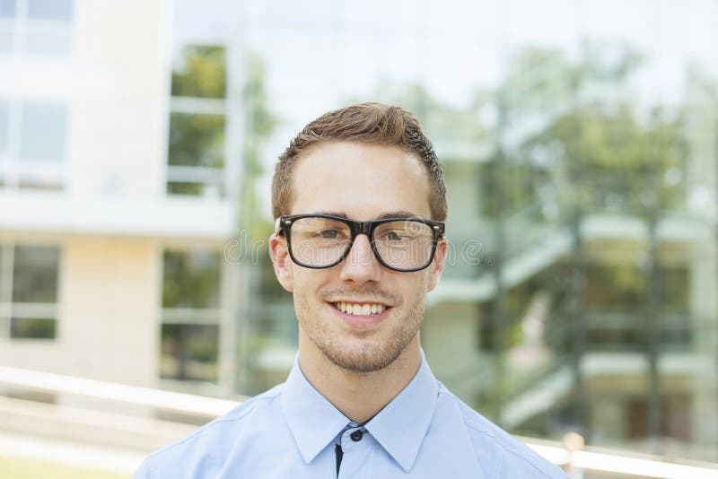 Good Looking Young Businessman With Retro Nerd Glasses, Outdoor portrait. Good Looking Young Businessman With Retro Nerd Glasses, Outdoor portrait