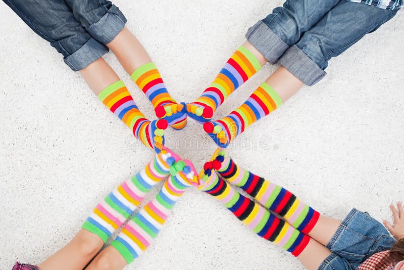 Legs with long colorful socks. Legs with long colorful socks