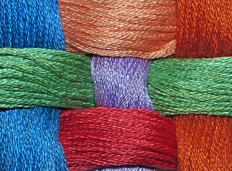 Different coloured wool arranged into overlapping strips. Different coloured wool arranged into overlapping strips.